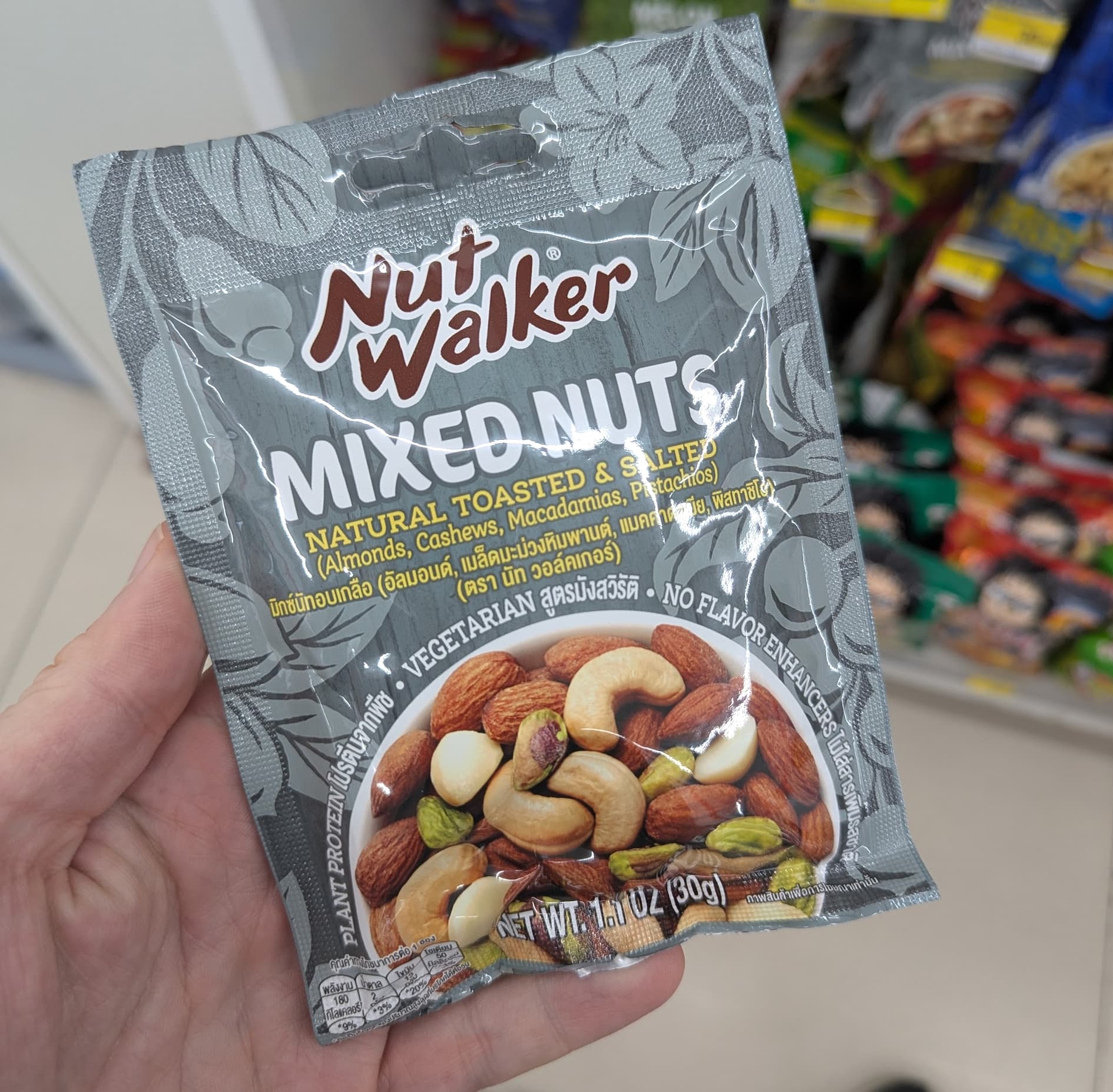 A 30g sachet of Nut Walker Mixed Nuts from a 7-Eleven in Thailand.