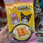 Koh-Kae Coffee Flavor Peanuts Review: An Iconic Thai Snack with a Bitter Kick Packaging of Ezygo Sausage Tteokbokki with Cheese Lava featuring My Melody and Kuromi.