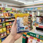 All Café Matcha Honey Lime: A Polarizing Zesty Refresher A person holding a bag of Diamond Grains Aurora Prebiotic Honey Flavour in a 7-Eleven store.