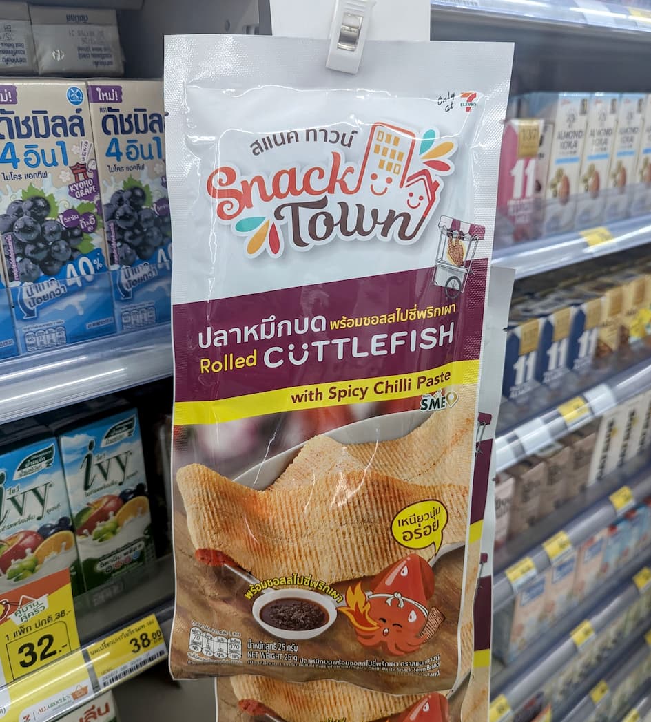 A bag of Snack Town Rolled Cuttlefish with Spicy Chilli Paste from 7-Eleven Thailand with a 2.8 rating.