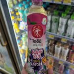 Ezygo Grilled Tamago with Takoyaki Sauce: A Quick Sweet Fix That Misses the Mark A plastic bottle of sweetened commercial green tea held inside a 7-Eleven store in Thailand.