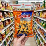 Luxury Ice Cubes: Upgrading Thailand’s Casual Drinking Culture An orange bag of Cornae American Corn Snack from 7-Eleven Thailand.