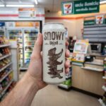 Plantaé Plant Protein Strawberry: A High-Protein Win for Vegans A can of Snowy Weizen by Singha in a chilled section of a Thai 7-Eleven.