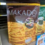 A red packaging pouch of Makado Sticks Barbecue flavor potato sticks from 7-Eleven Thailand.